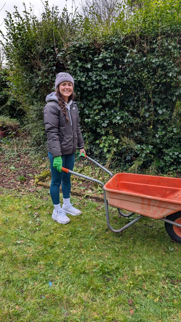 Celine busy with a wheelbarrow